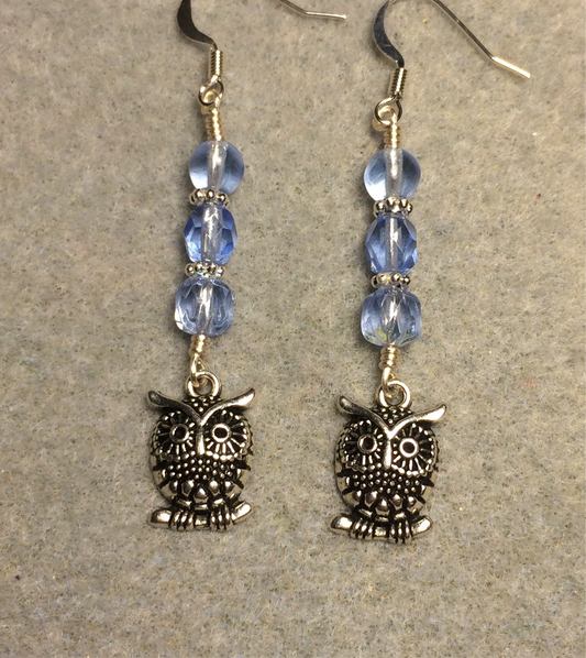 Silver owl charm earrings adorned with light blue Czech glass beads