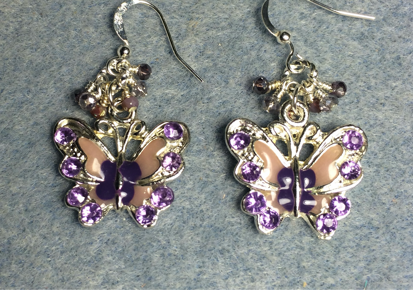 Silver and purple enamel and rhinestone butterfly charm earrings adorned with tiny dangling purple and silver Chinese crystal beads.