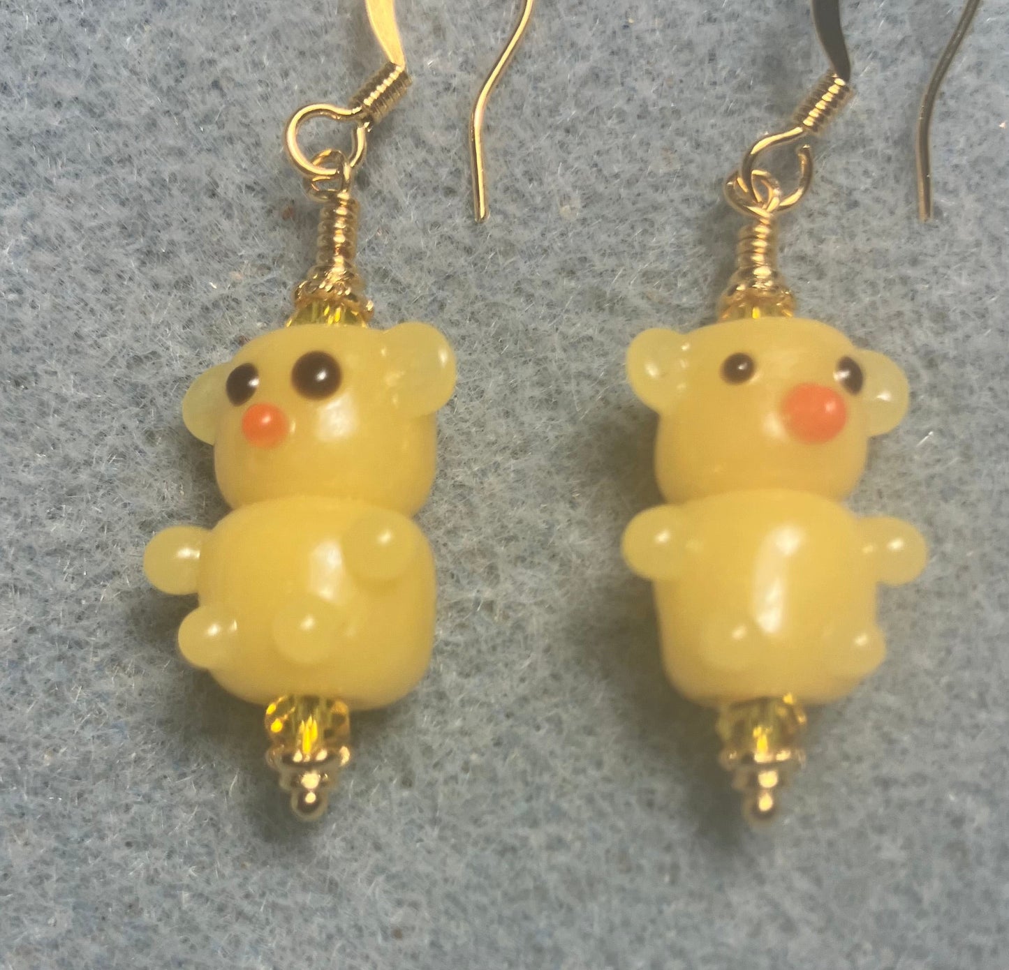 Small amber yellow lamp work teddy bear bead earrings adorned with amber Chinese crystal beads.