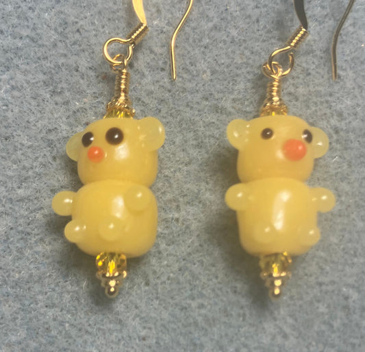 Small amber yellow lamp work teddy bear bead earrings adorned with amber Chinese crystal beads.