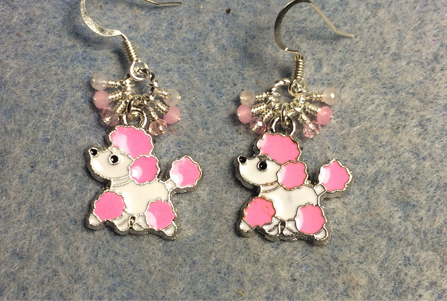 Pink and white enamel poodle charm earrings adorned with tiny dangling pink and white Chinese crystal beads.