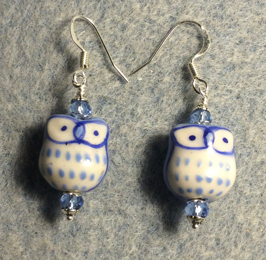 Light blue ceramic spotted owl bead earrings adorned with light blue Chinese crystal beads.