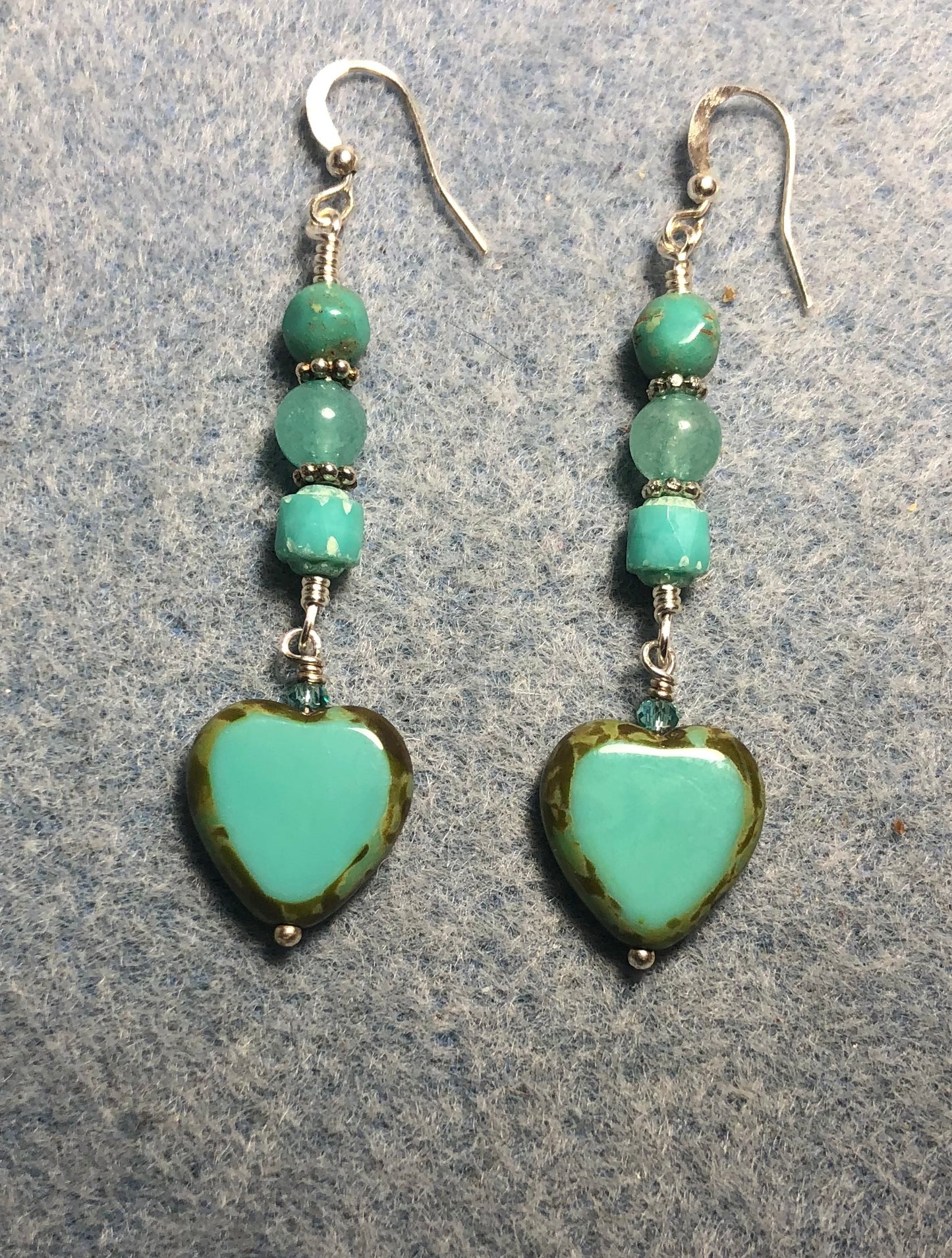 Opaque turquoise Czech glass heart bead earrings adorned with turquoise Czech glass beads.