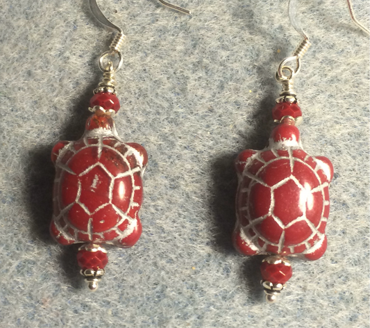 Opaque red (with silver inlay) Czech glass turtle bead earrings adorned with red Chinese crystal beads.