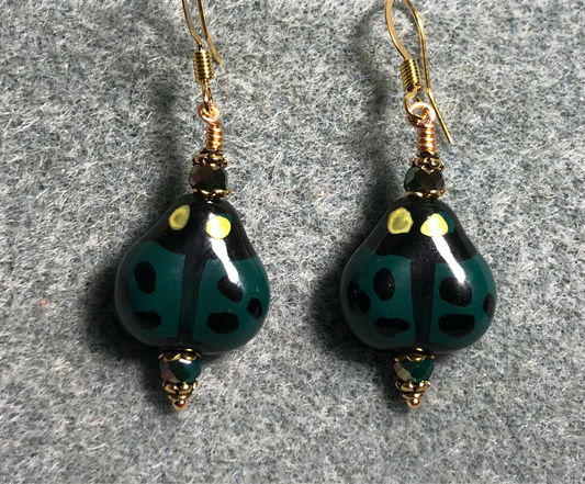 Dark green and black ceramic ladybug bead earrings adorned with dark green Chinese crystal beads.