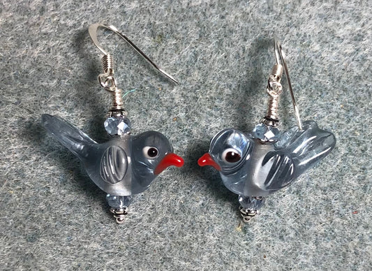 Translucent light blue lamp work songbird bead earrings adorned with light blue Chinese crystal beads.