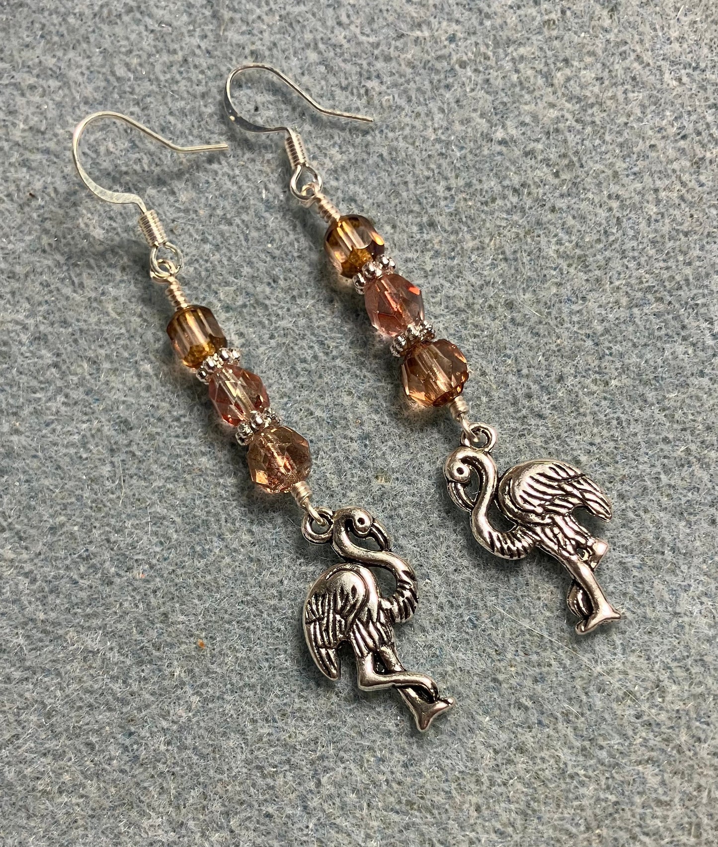 Silver flamingo charm earrings adorned with rose gold Czech glass beads