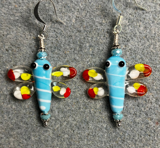 Light blue, red, and yellow lamp work dragonfly bead earrings adorned with light blue Chinese crystal beads.