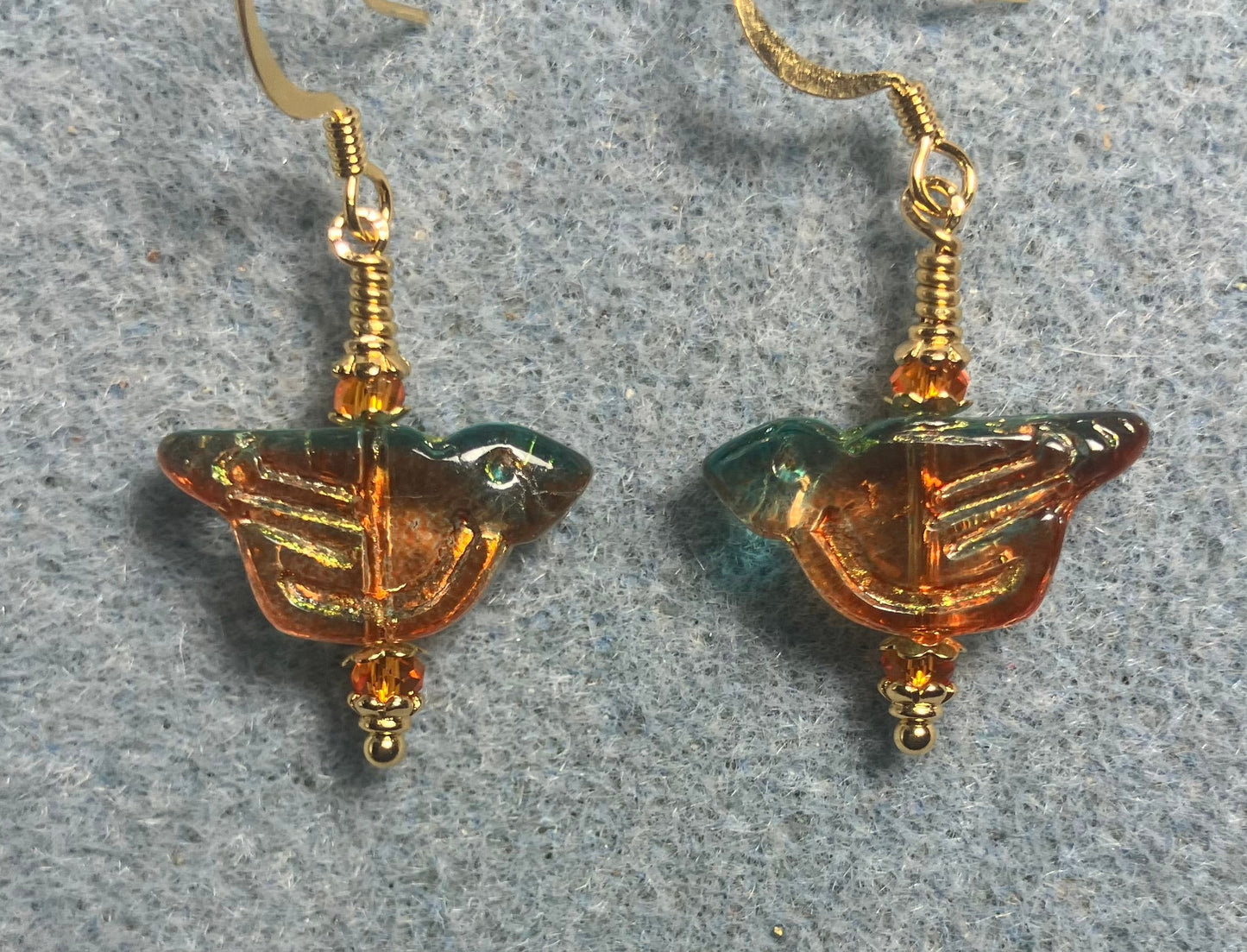 Translucent teal and tangerine (with gold wash) Czech glass bird bead earrings adorned with tangerine Chinese crystal beads.