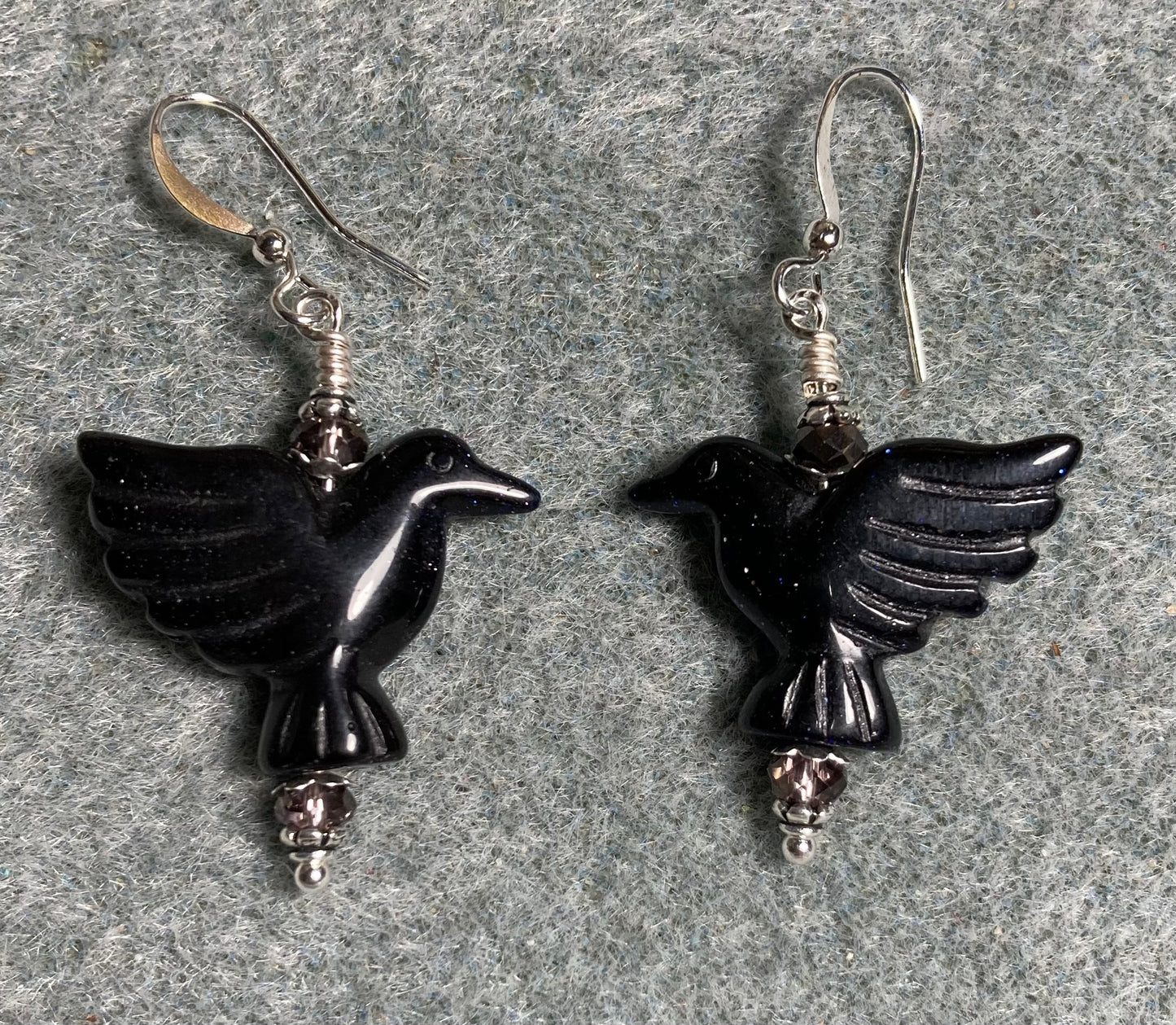 Blue goldstone gemstone flying eagle bead earrings adorned with purple Chinese crystal beads.
