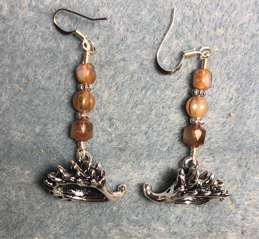 Large silver three-dimensional hedgehog charm earrings adorned with light brown Czech glass beads