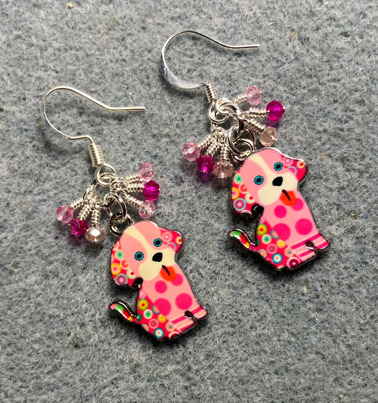 Pink and white enamel silly dog charm earrings adorned with tiny dangling hot pink and light pink Chinese crystal beads.