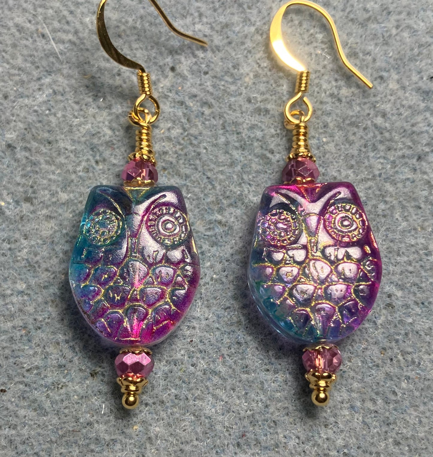 Sparkly pink and turquoise (with gold wash) Czech glass owl bead earrings adorned with pink Chinese crystal beads.