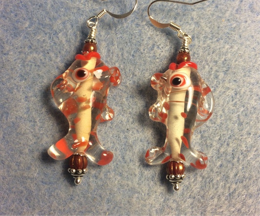 Dark orange and clear lamp work fish bead earrings adorned with dark orange Czech glass beads.