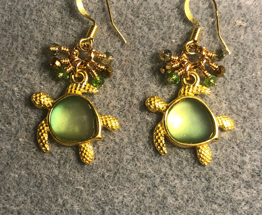 Gold and green fiber optic sea turtle charm earrings adorned with tiny dangling olive green and gold Chinese crystal beads.