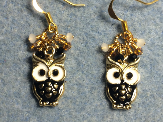 Black and white enamel owl charm earrings adorned with tiny dangling black, white, and amber Chinese crystal beads.