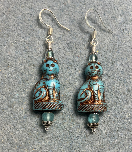 Opaque turquoise (with copper inlay) fancy Czech glass cat bead earrings adorned with light turquoise Czech glass beads.