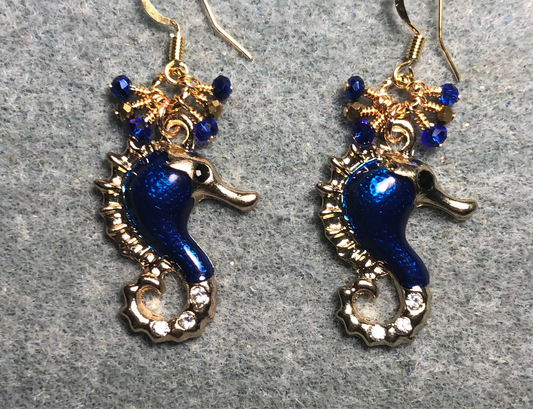 Dark blue enamel and rhinestone seahorse charm earrings adorned with tiny dangling dark blue and gold Chinese crystal beads.