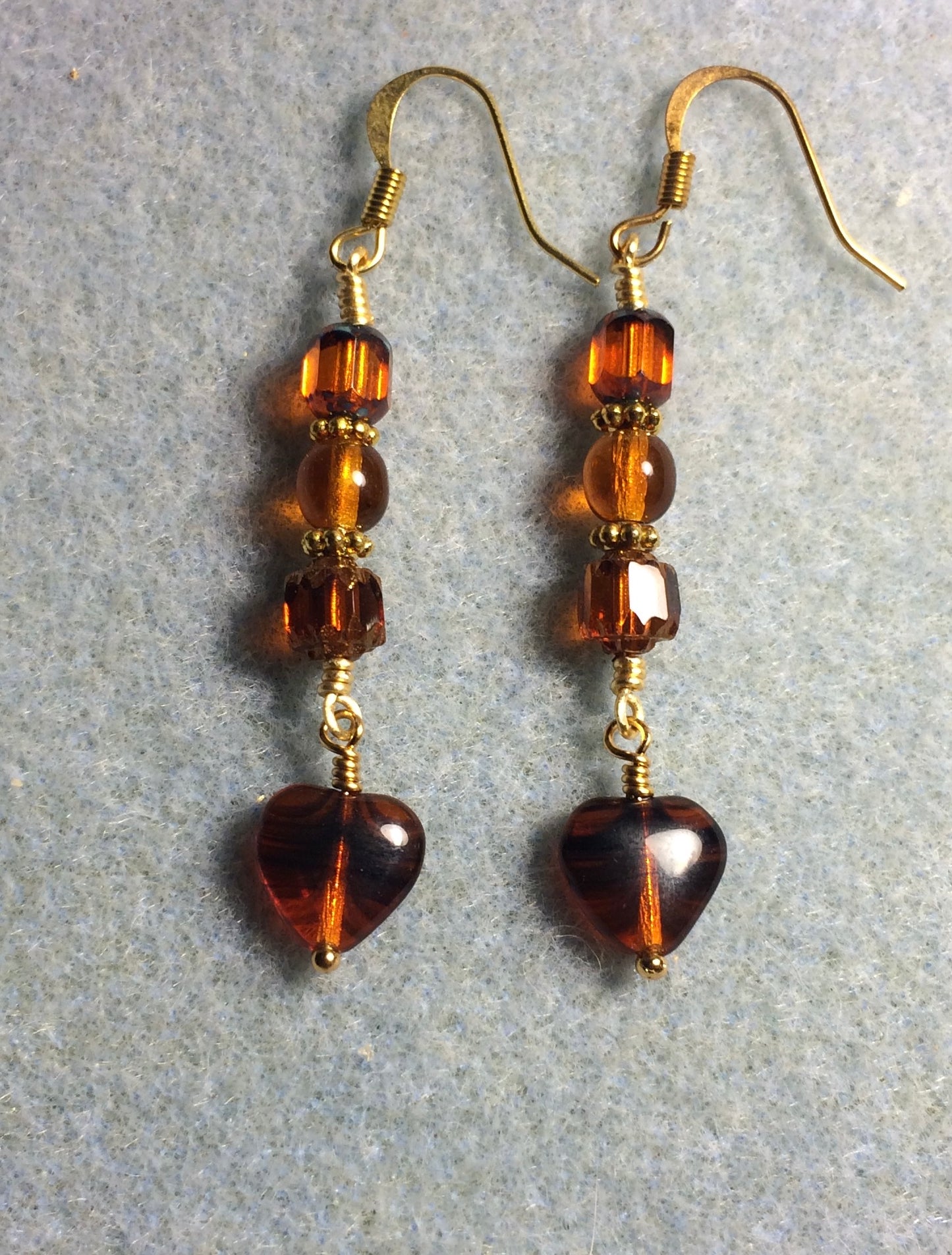 Small orange brown striped Czech glass heart bead earrings adorned with orange brown Czech glass beads.