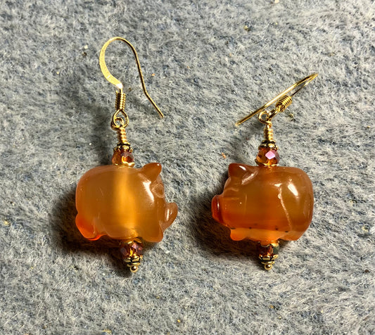 Orange carnelian gemstone pig bead earrings adorned with orange Chinese crystal beads.