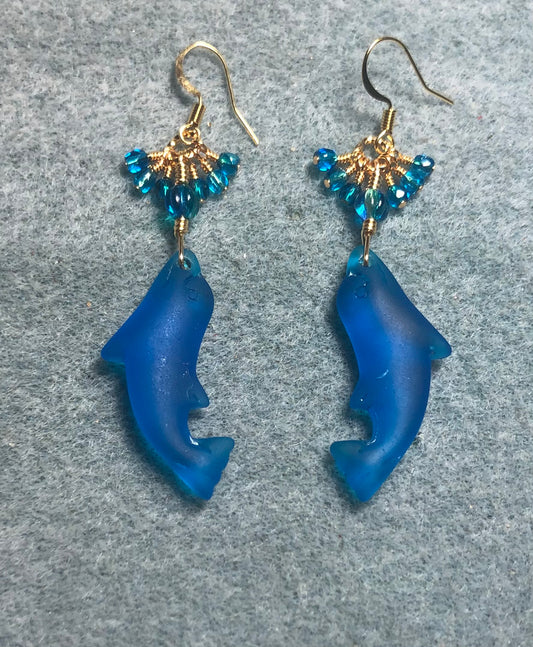 Turquoise blue sea glass dolphin pendant bead earrings adorned with turquoise Czech glass beads and tiny dangling turquoise Czech glass beads.