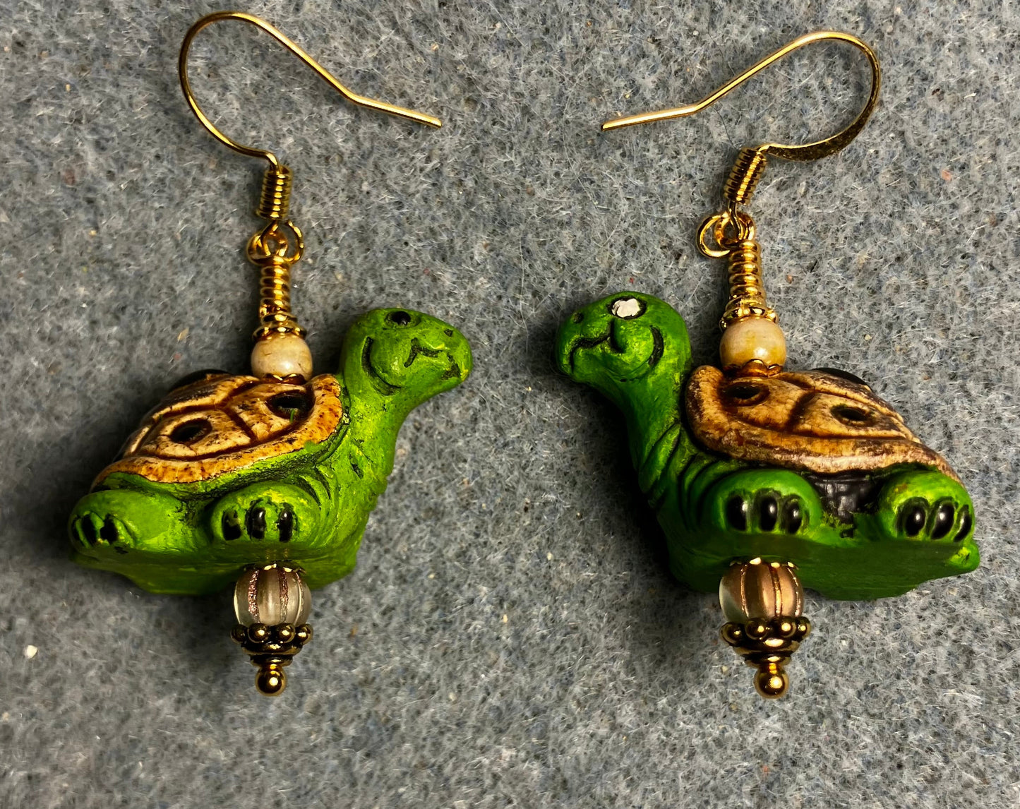 Green and tan ceramic turtle bead earrings adorned with tan Czech glass beads.