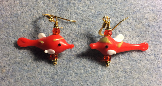 Small red and white lamp work fish bead earrings adorned with red Chinese crystal beads.