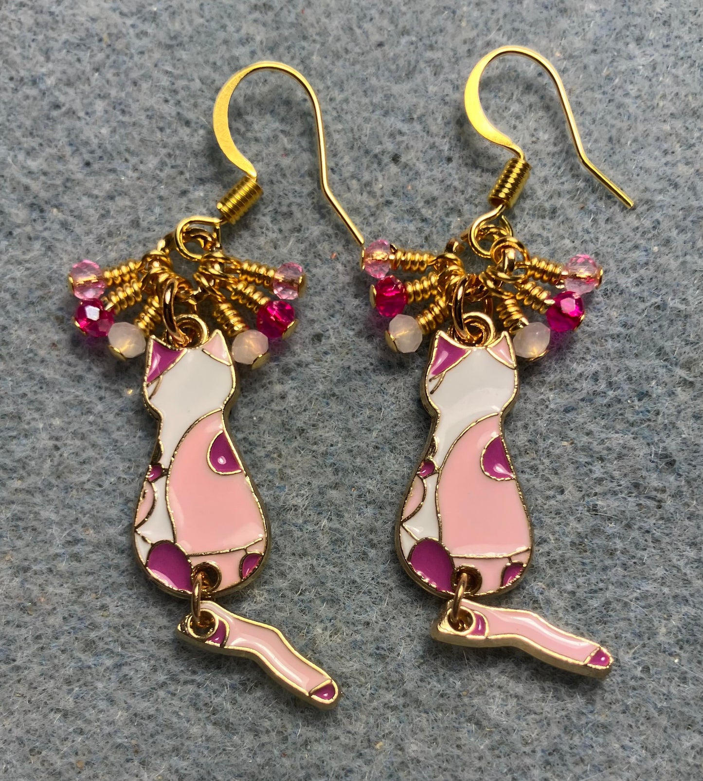 Hot pink, light pink, and white enamel cat charm earrings adorned with tiny dangling hot pink, light pink, and white Chinese crystal beads.