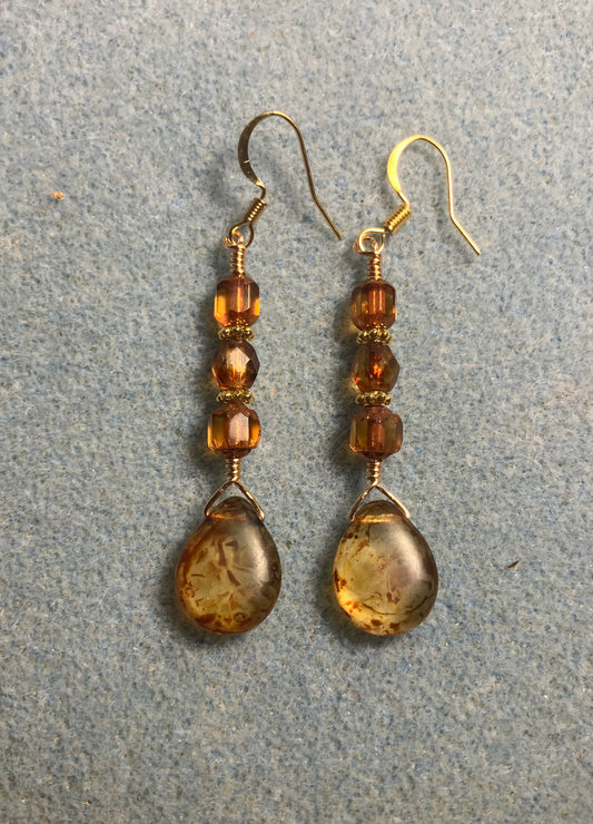 Amber brown Czech glass pear drop bead earrings adorned with dark amber Czech glass beads.