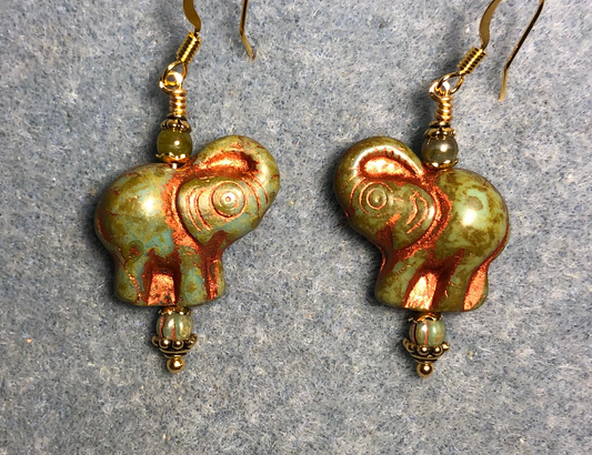 Green (with copper inlay) Czech glass elephant bead earrings adorned with green Czech glass beads.