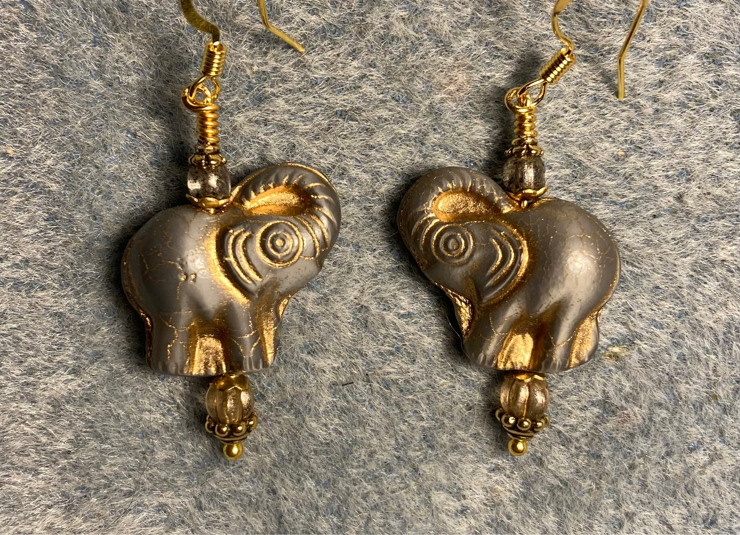 Gray (with gold inlay) Czech glass elephant bead earrings adorned with grayish gold Czech glass beads.