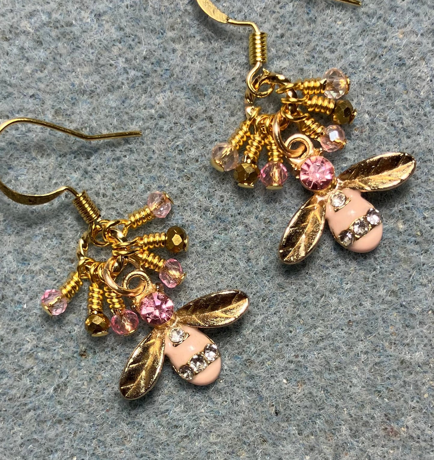 Gold and pink enamel and rhinestone honeybee charm earrings adorned with tiny dangling pink and gold Chinese crystal beads.