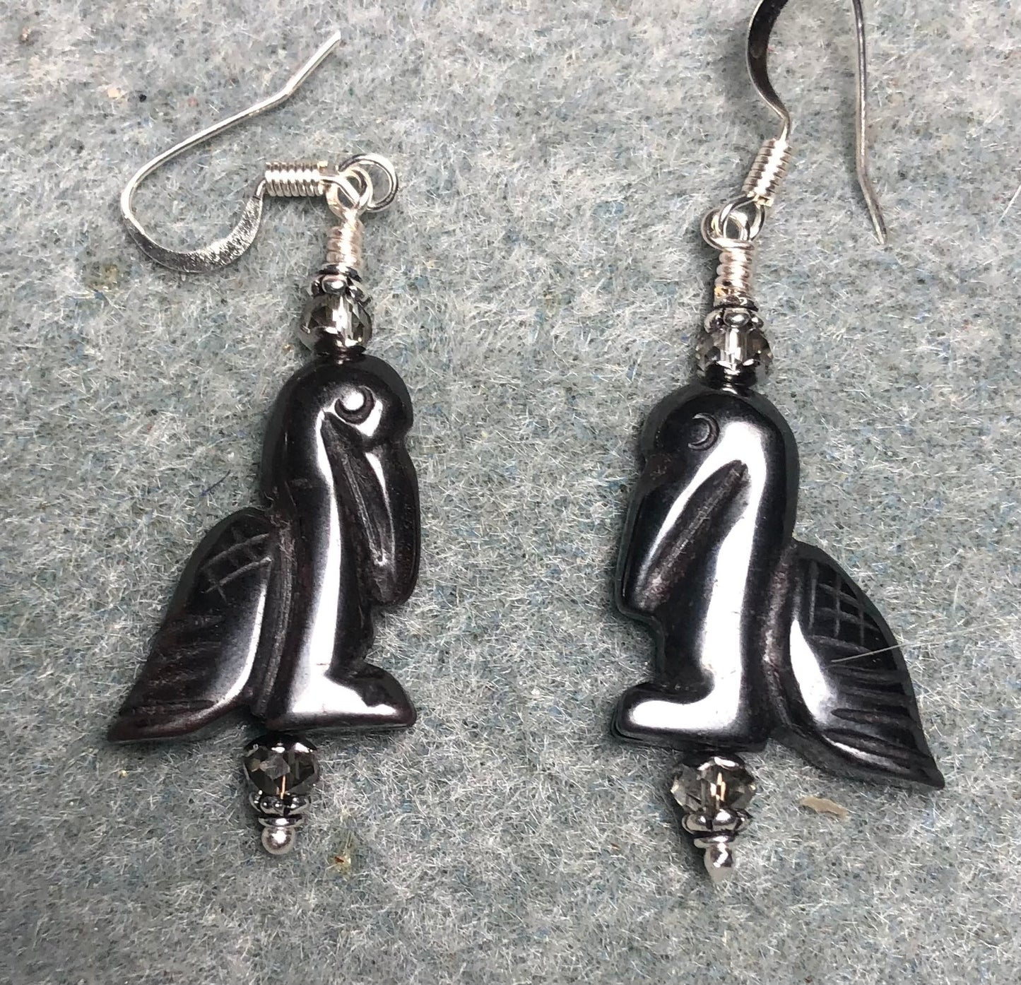 Hematite gemstone pelican bead earrings adorned with clear Chinese crystal beads.