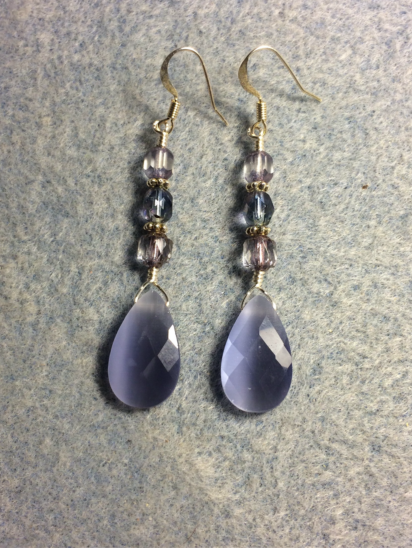 Light violet fiber optic briolette bead earrings adorned with light violet Czech glass beads.