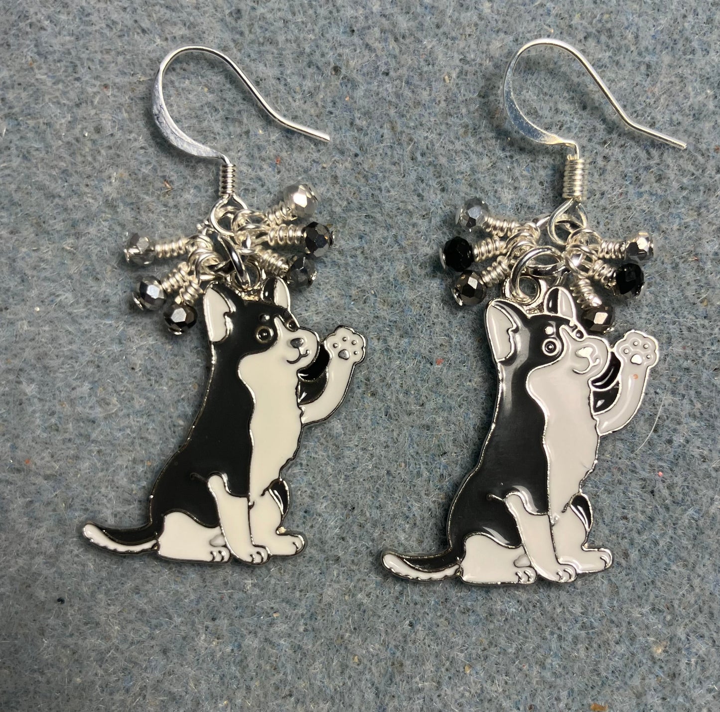 Gray and white enamel husky charm earrings adorned with tiny dangling black, gray, and silver Chinese crystal beads.