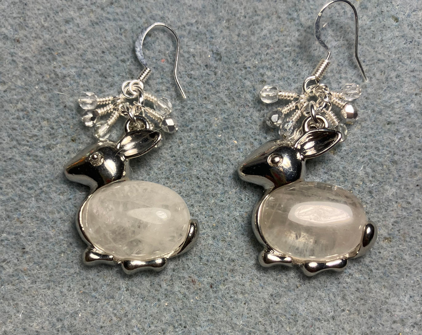 Large silver and rock crystal gemstone rabbit charm earrings adorned with small dangling clear and silver Czech glass beads.