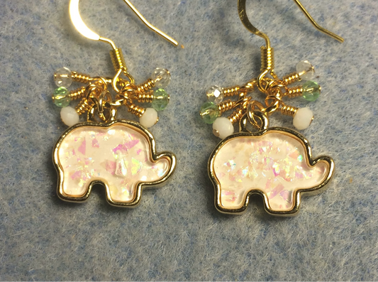 White imitation opal elephant charm earrings adorned with tiny dangling white, light green, and gold Chinese crystal beads.