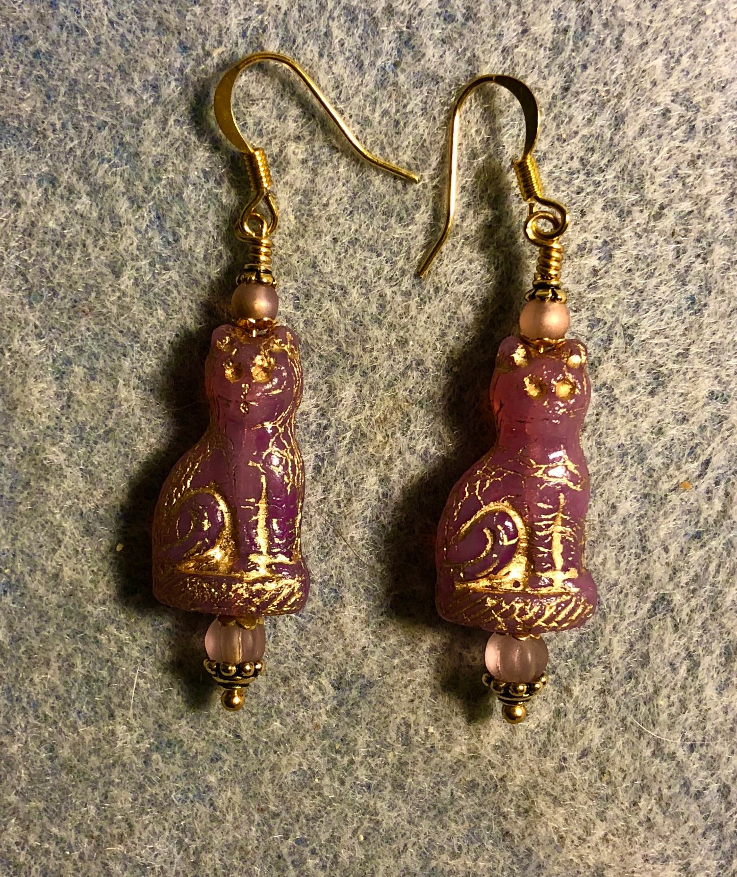 Pink (with gold inlay) fancy Czech glass cat bead earrings adorned with pinkish violet Czech glass beads.