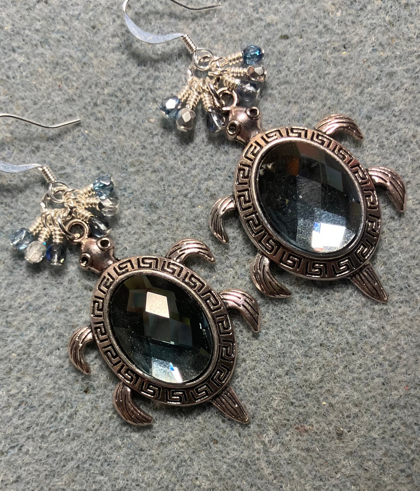 Large silver and Montana blue rhinestone turtle charm earrings adorned with small dangling Montana blue and silver Czech glass beads.