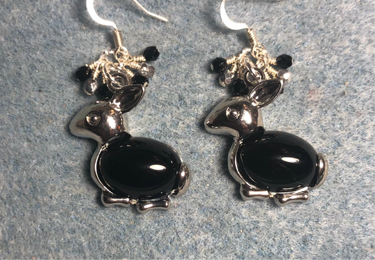 Large silver and black onyx gemstone rabbit charm earrings adorned with small dangling black and silver Czech glass beads.