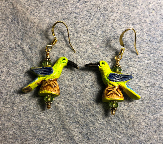 Small green and dark blue bird bead earrings adorned with green Chinese crystal beads.