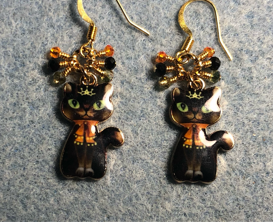 Black and orange enamel cat charm earrings adorned with small dangling black, orange, and gold Chinese crystal beads.