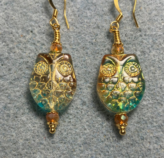 Sparkly green and orange (with gold wash) Czech glass owl bead earrings adorned with orange Chinese crystal beads.