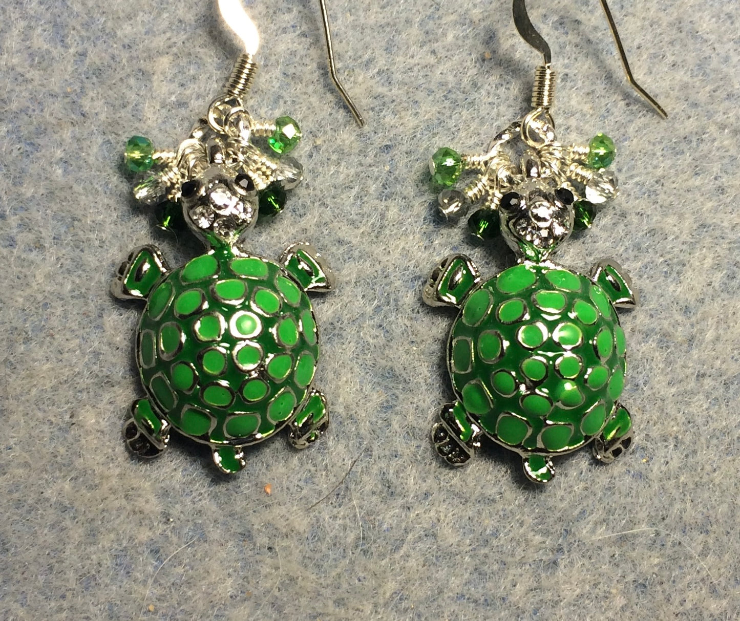 Green enamel mosaic turtle charm earrings adorned with tiny dangling green and silver Chinese crystal beads.