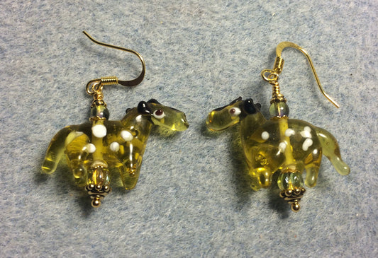 Translucent greenish amber lamp work spotted horse bead earrings adorned with olive green Czech glass beads.