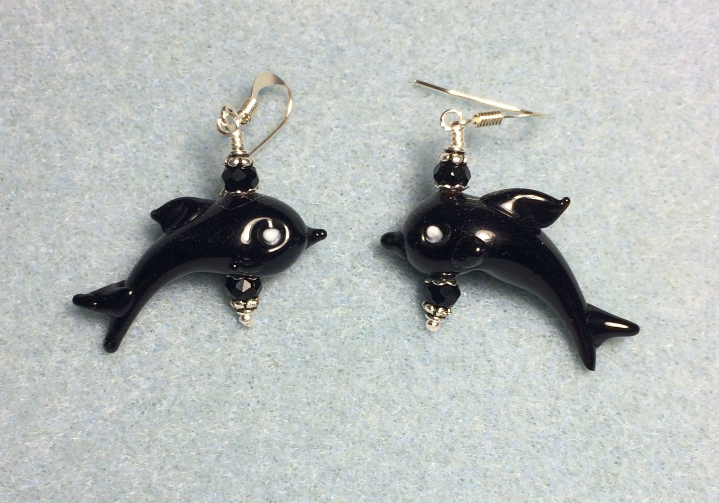 Black lamp work dolphin bead earrings adorned with black Chinese crystal beads.