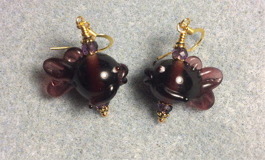Purple lamp work fish bead earrings adorned with purple Chinese crystal beads.