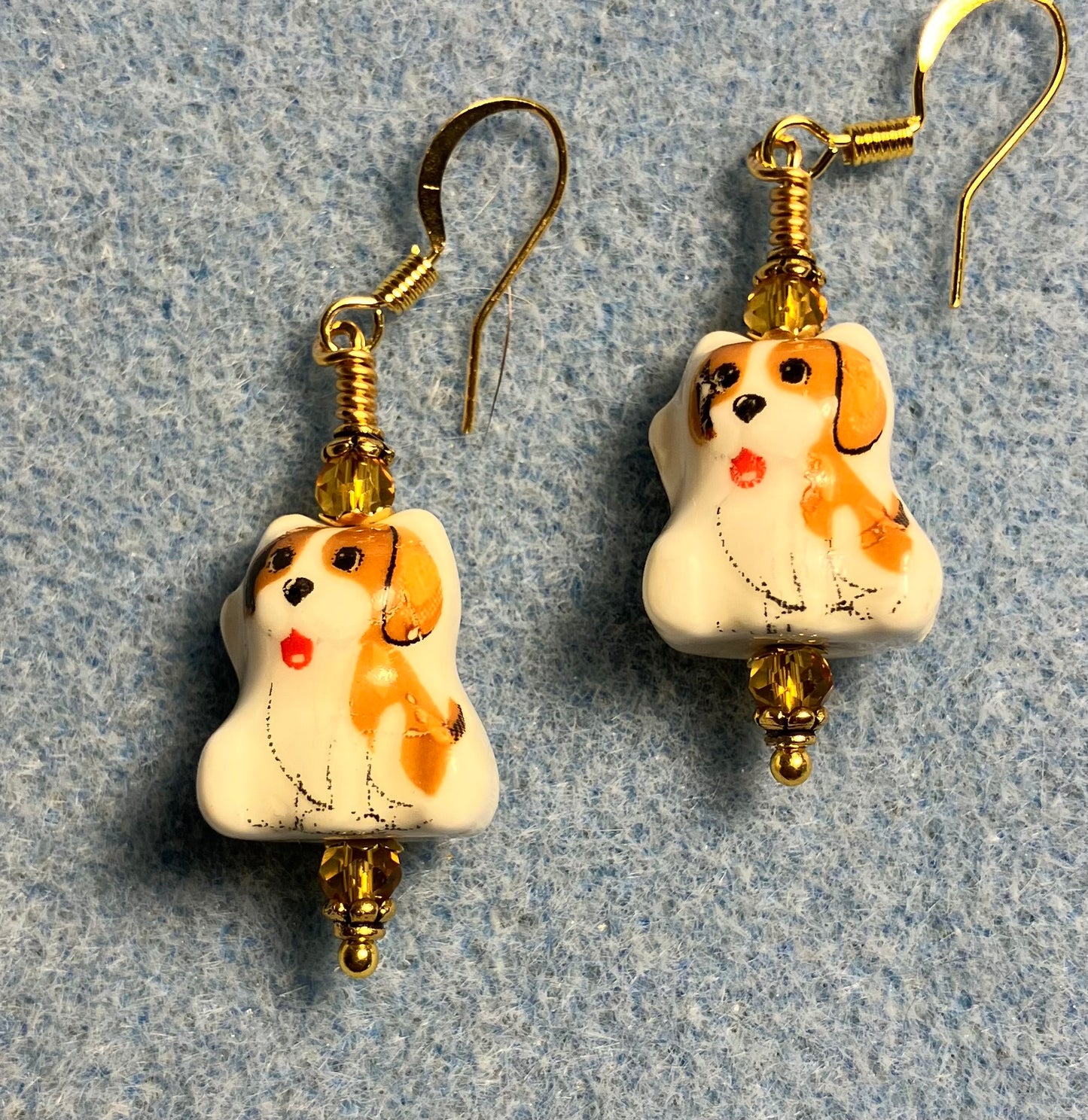 Amber and white ceramic puppy dog bead earrings adorned with amber Chinese crystal beads.