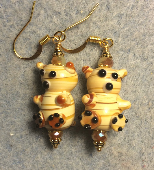 Small tan lamp work striped teddy bear bead earrings adorned with tan Chinese crystal beads.