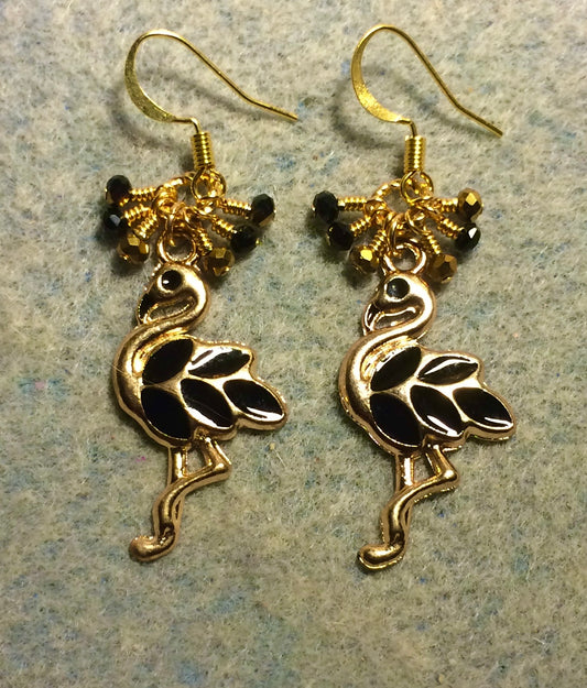Black and gold enamel flamingo charm earrings adorned with tiny dangling black and gold Chinese crystal beads.